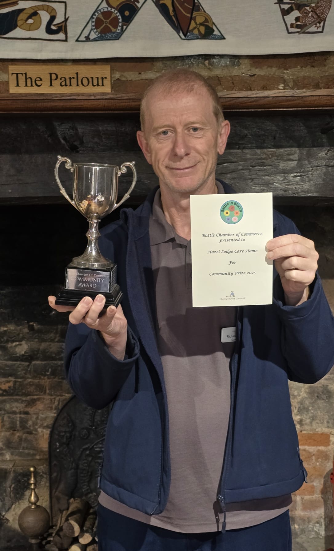 Our gardener Richard receiving our Battle in Bloom Trophy