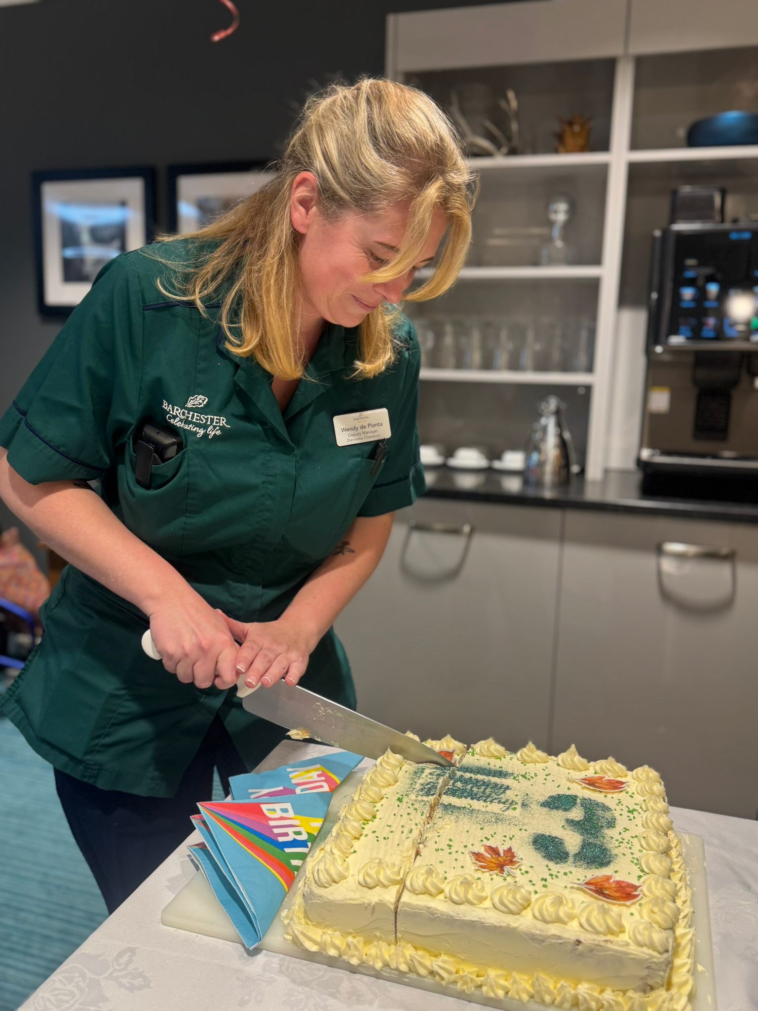 Deputy Manager Wendy cutting our anniversary cake