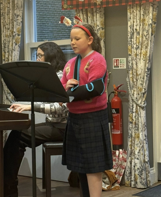 Solo Singing from the Students from Tudor Hall School was a delight for the residents