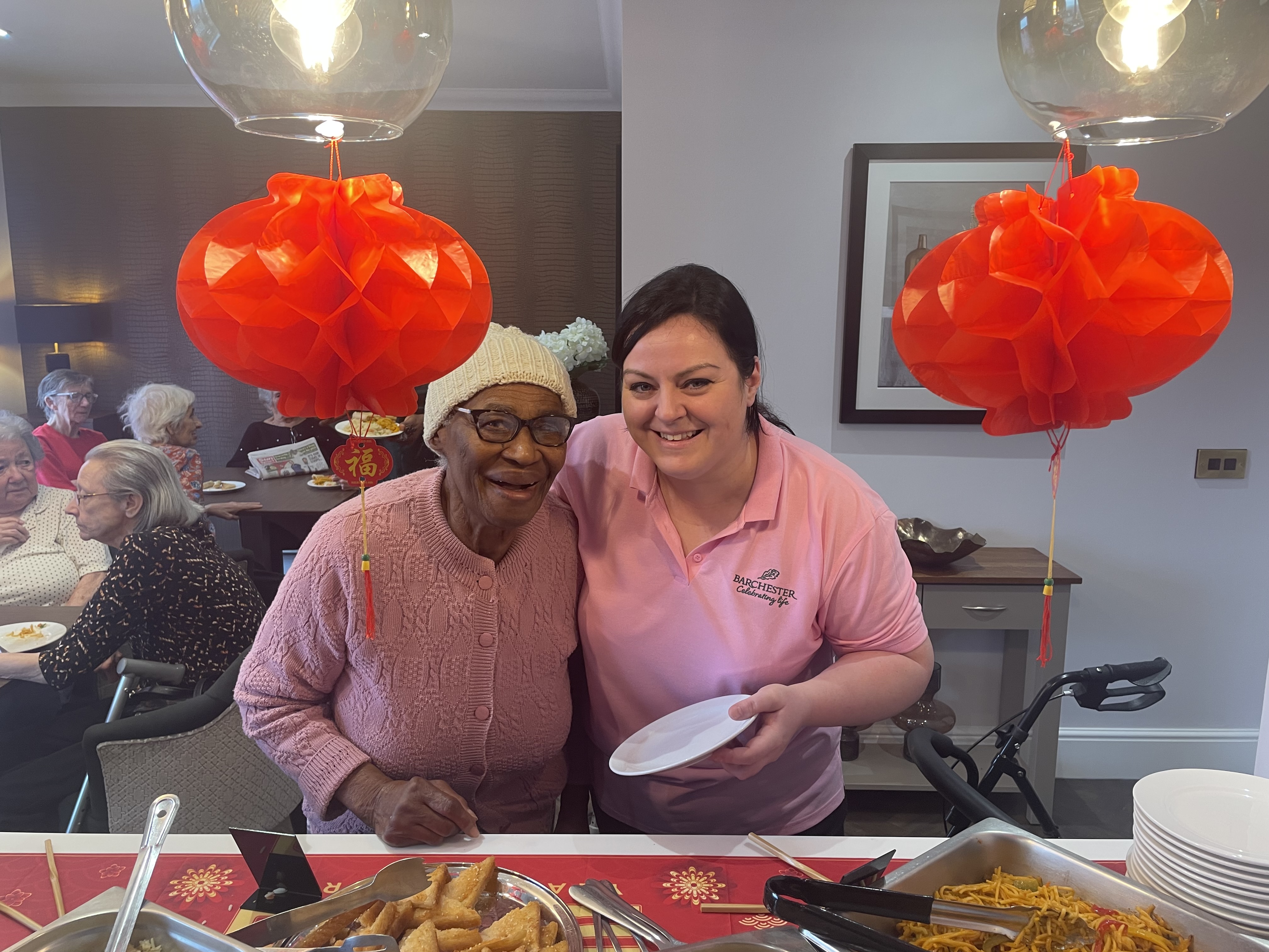 Activities Lead Beck enjoyed supporting residents to choose from the selection of Chinese food at the event