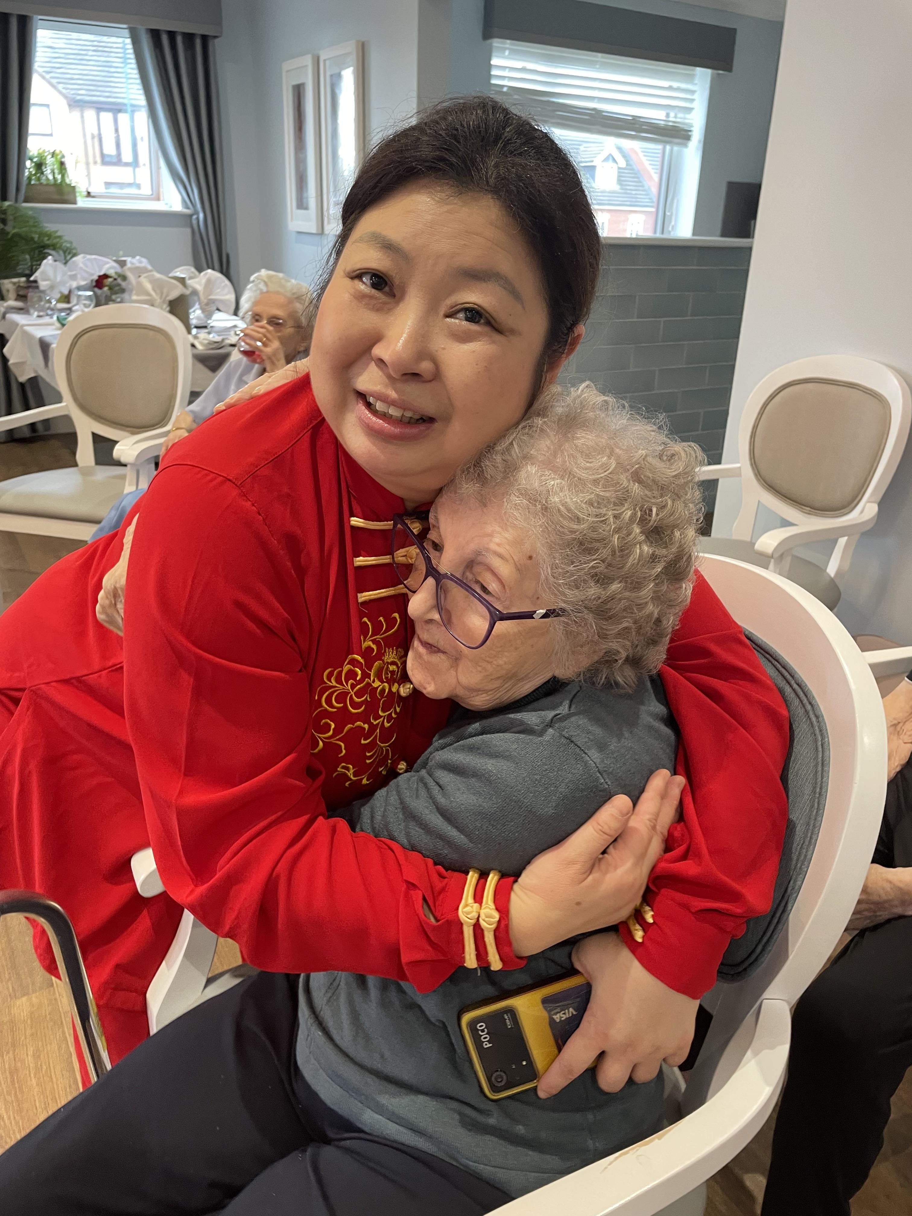 Faustina Yang shows love and care to the homes residents