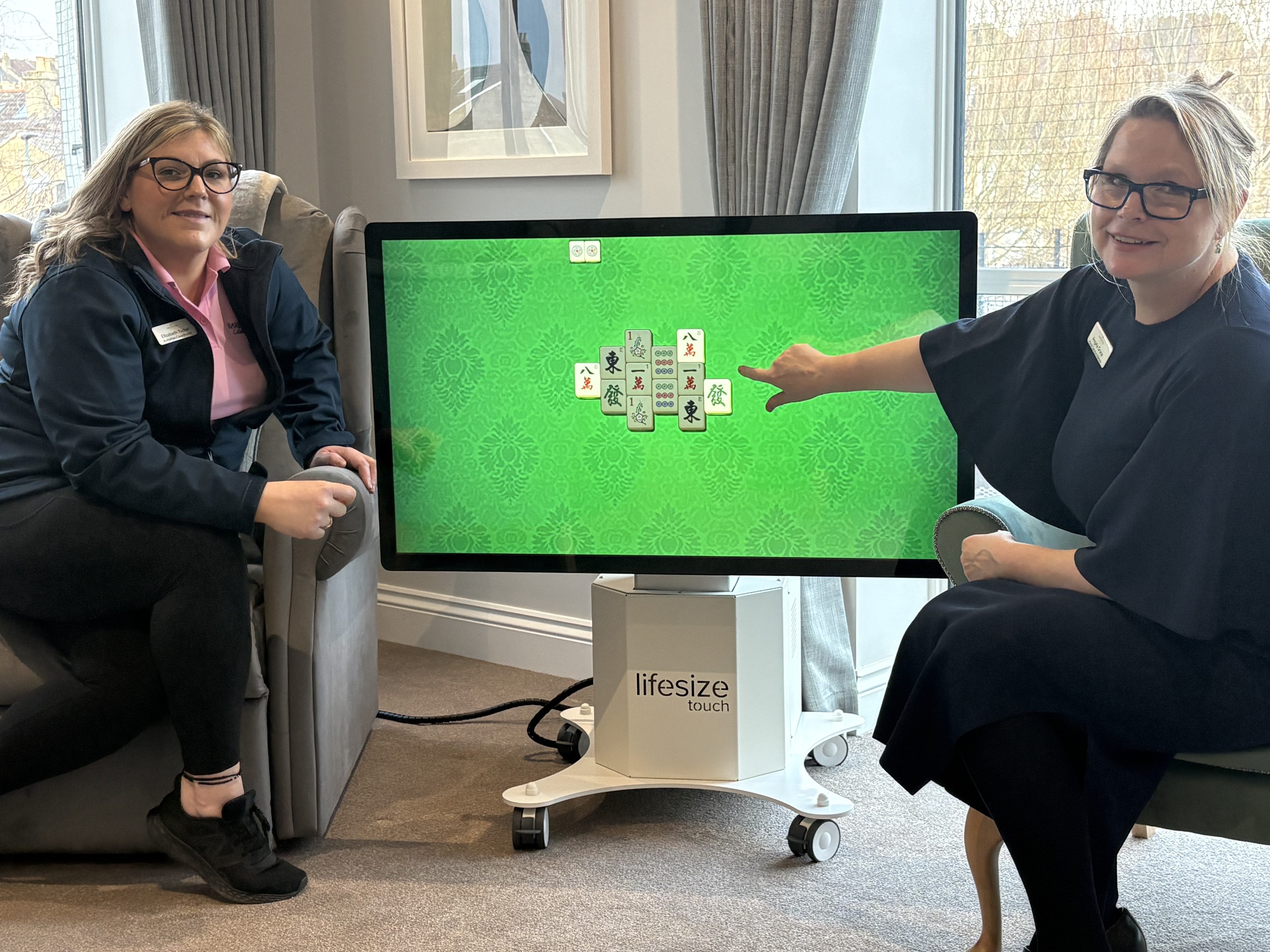 Elizabeth and Angela enjoying Mahjong