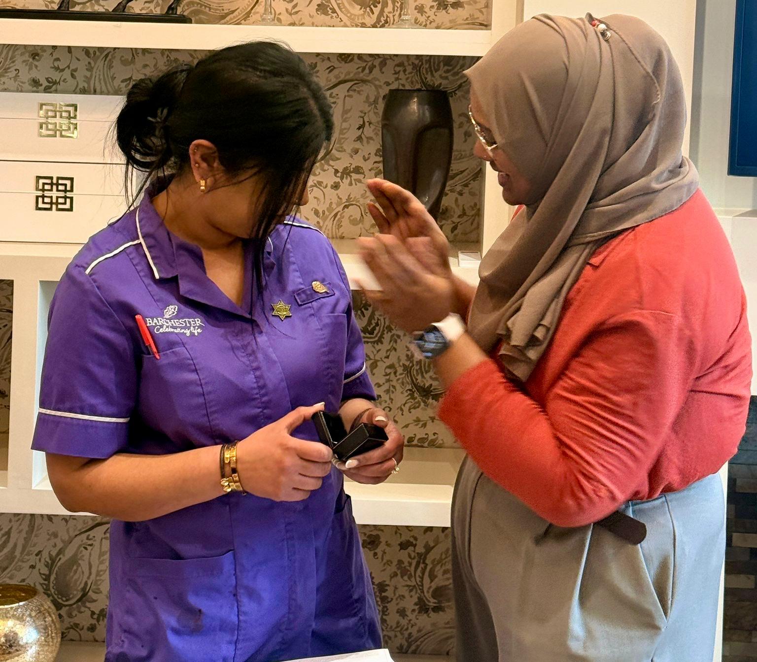 General Manager Benazir Shakkir puts the pin on Snobia and congratulates her