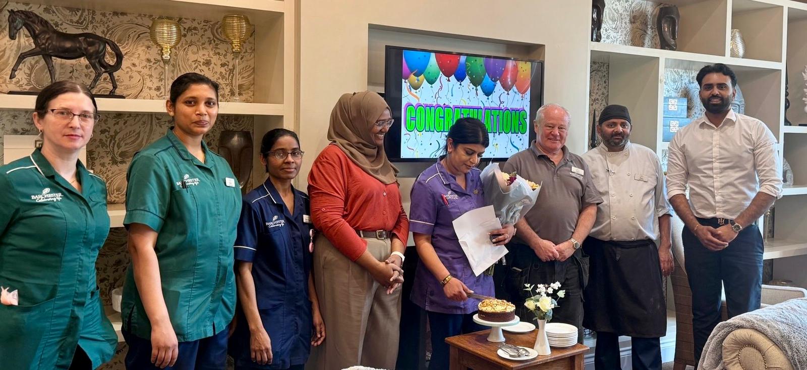 Staff join the celebration to congratulate Snobia