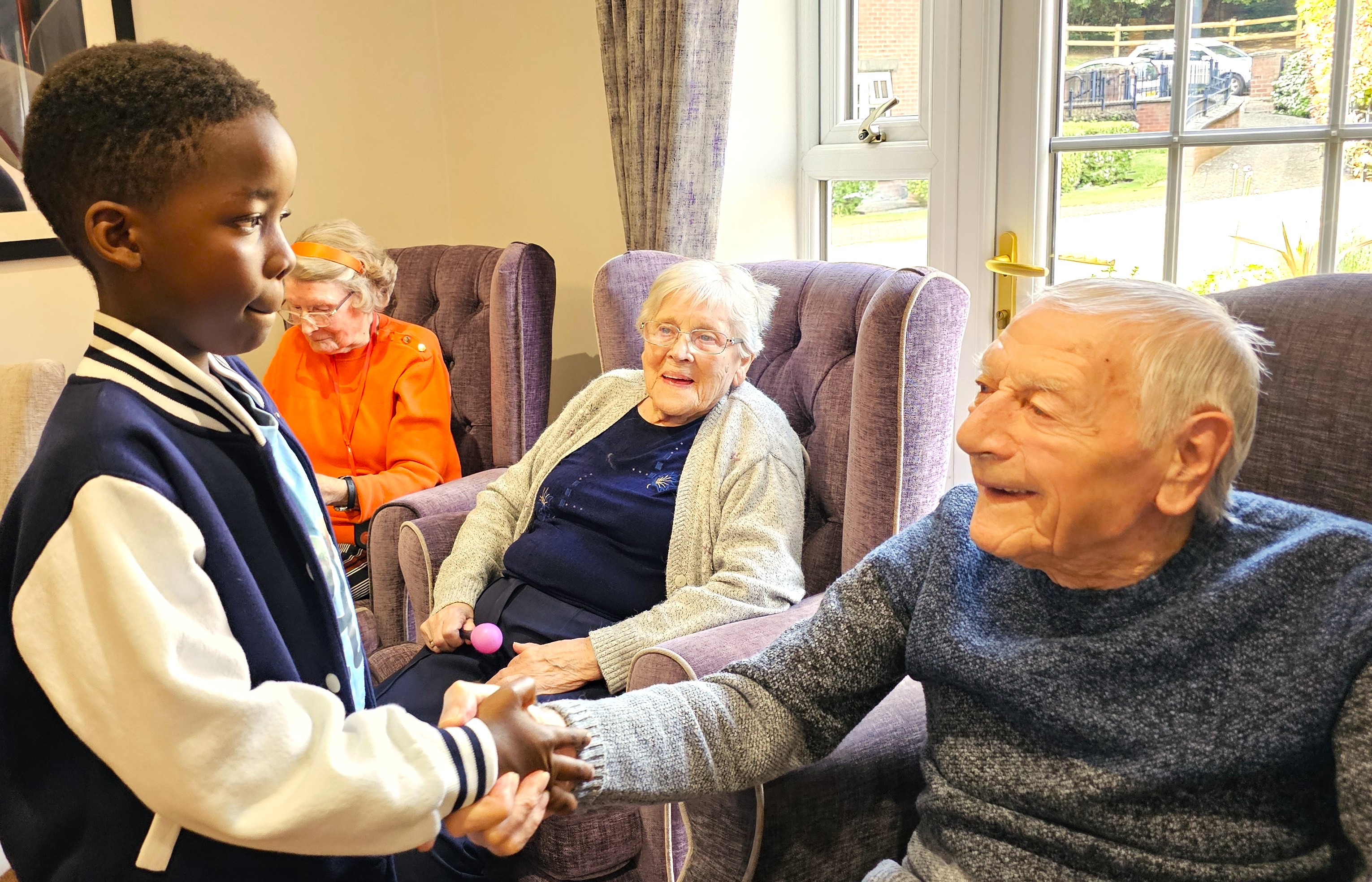 Child from Seventh Day Adventist Church Engaging With A Resident