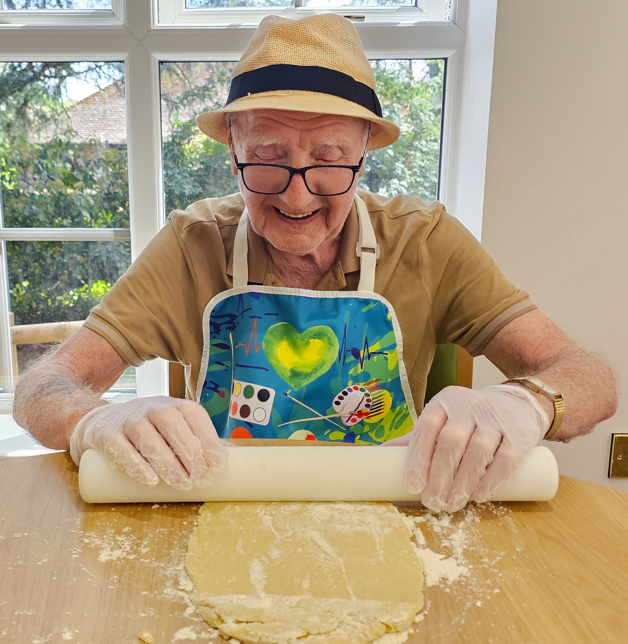 Resident taking part in biscuit baking