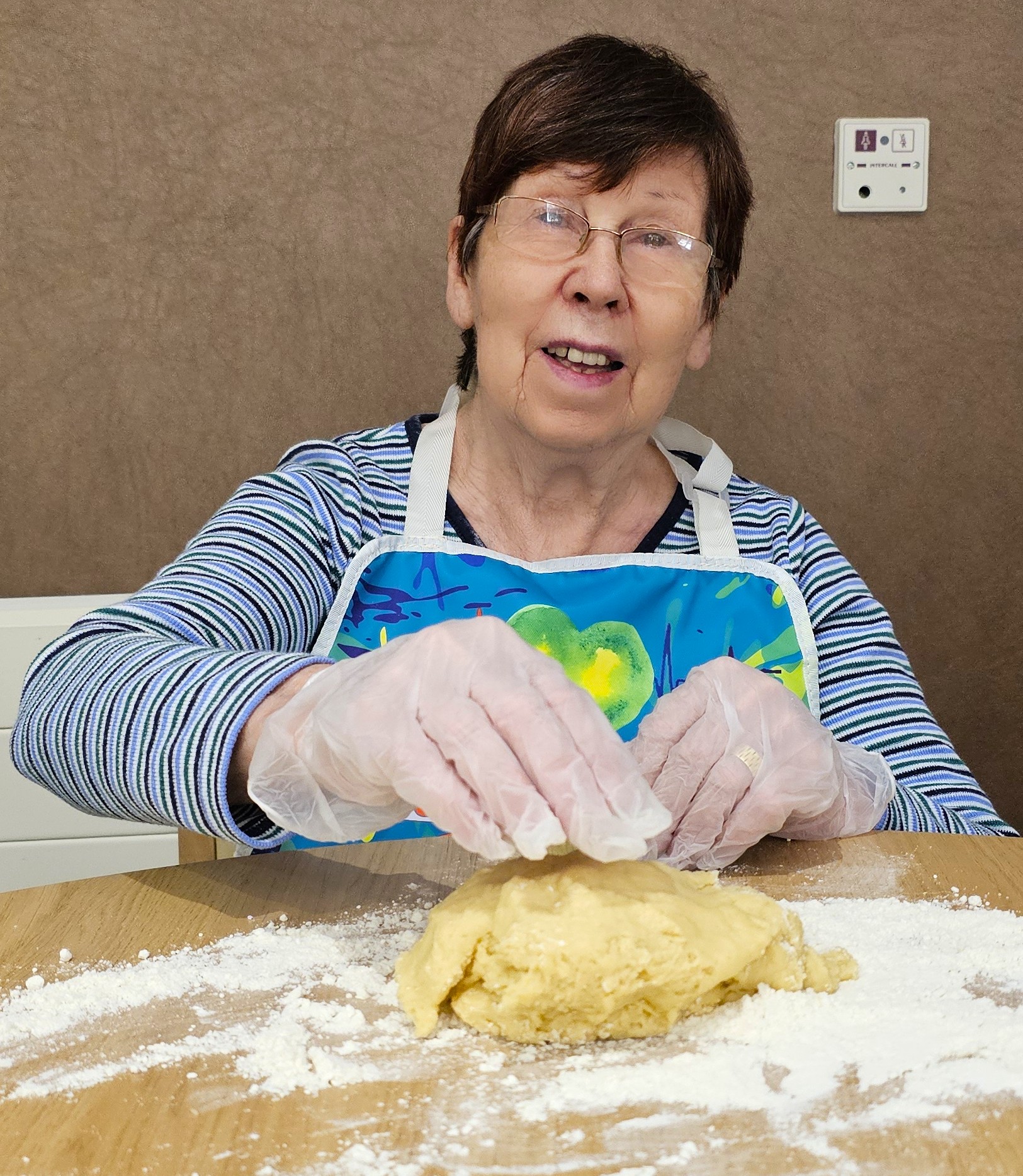 Resident taking part in biscuit baking