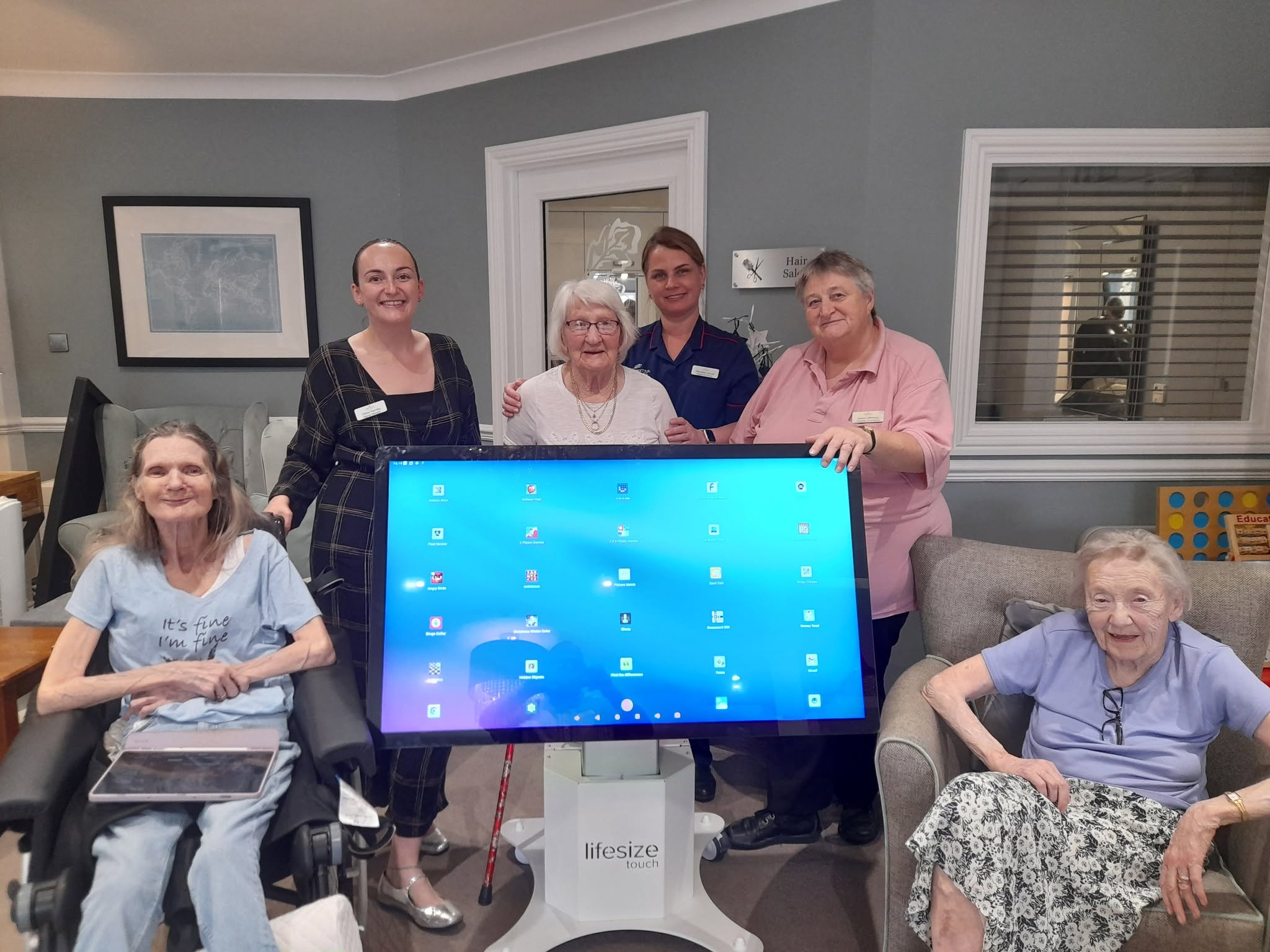 Residents and staff with digital table 