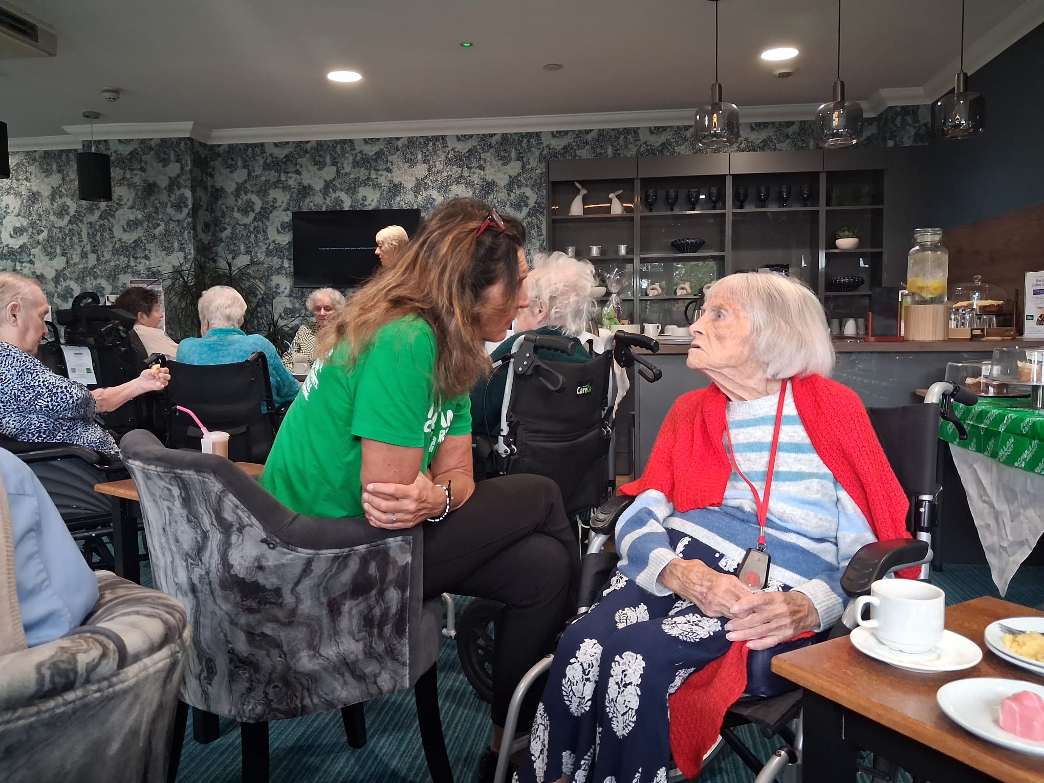 Sonia Tudor from Macmillan with residents 