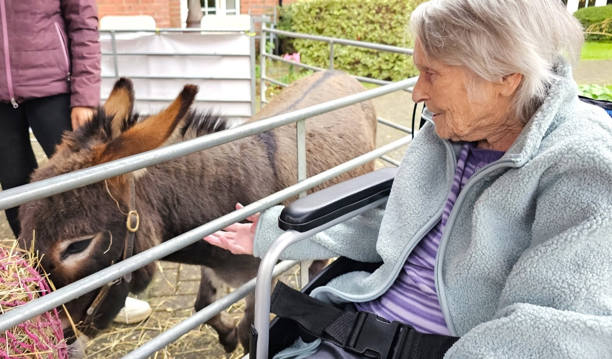 Residents Enjoy Donkey Visit to Home