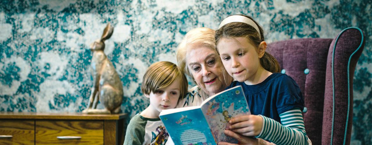 Woman and children reading