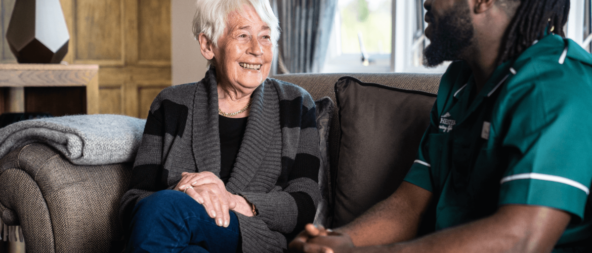 Barchester Nurse speaking to a care home resident