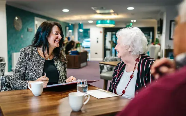 Two ladies in a cafeteria