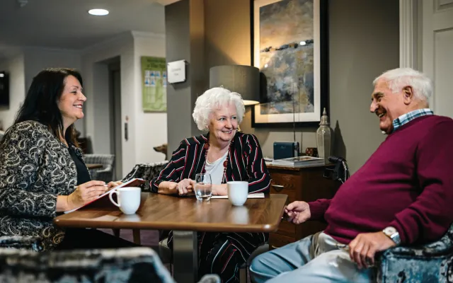 A nursing care staff member discussing fees