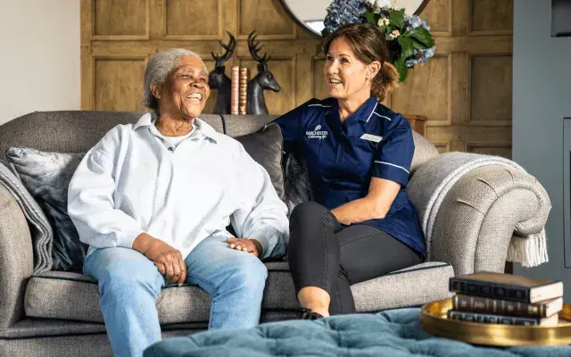 A resident and a nurse at a nursing care home