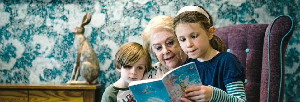 Woman and children reading