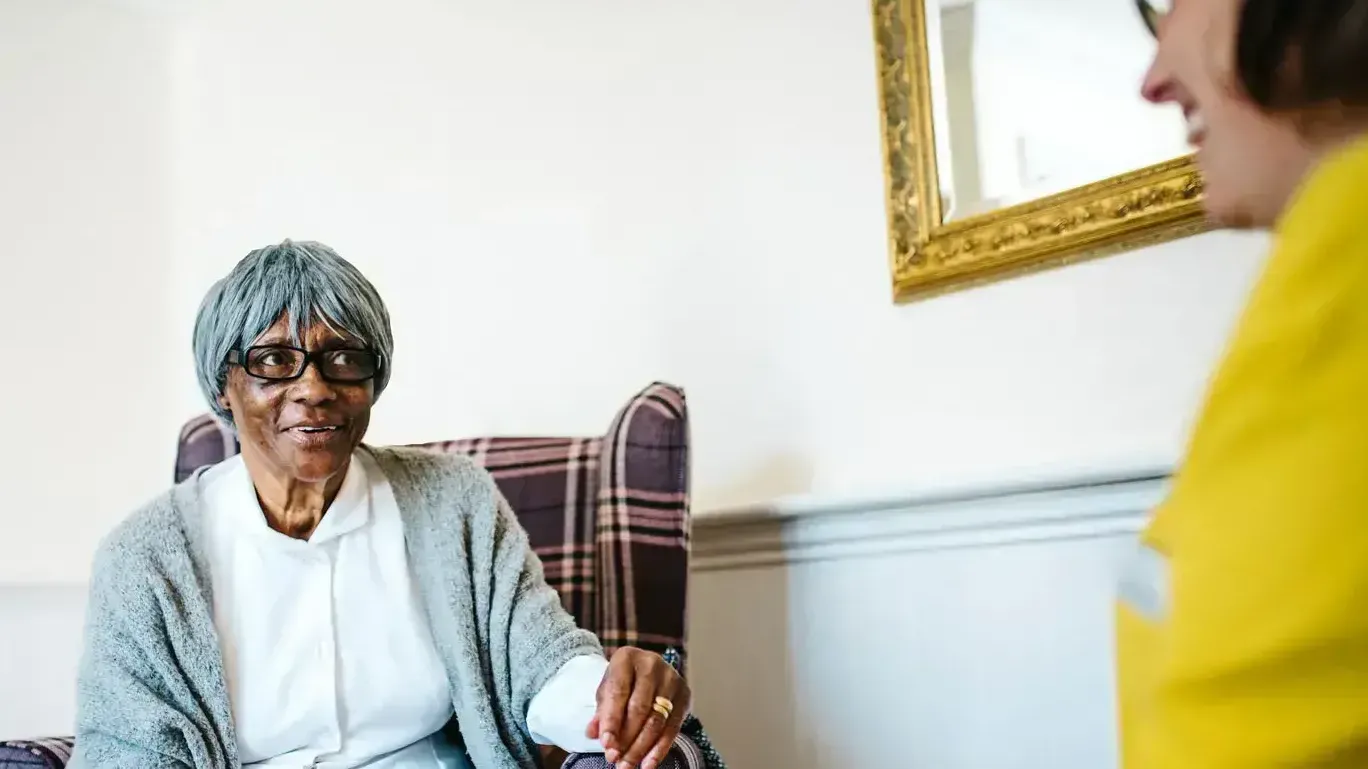 Woman sat in an armchair