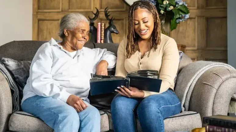 Women looking at a photo album together