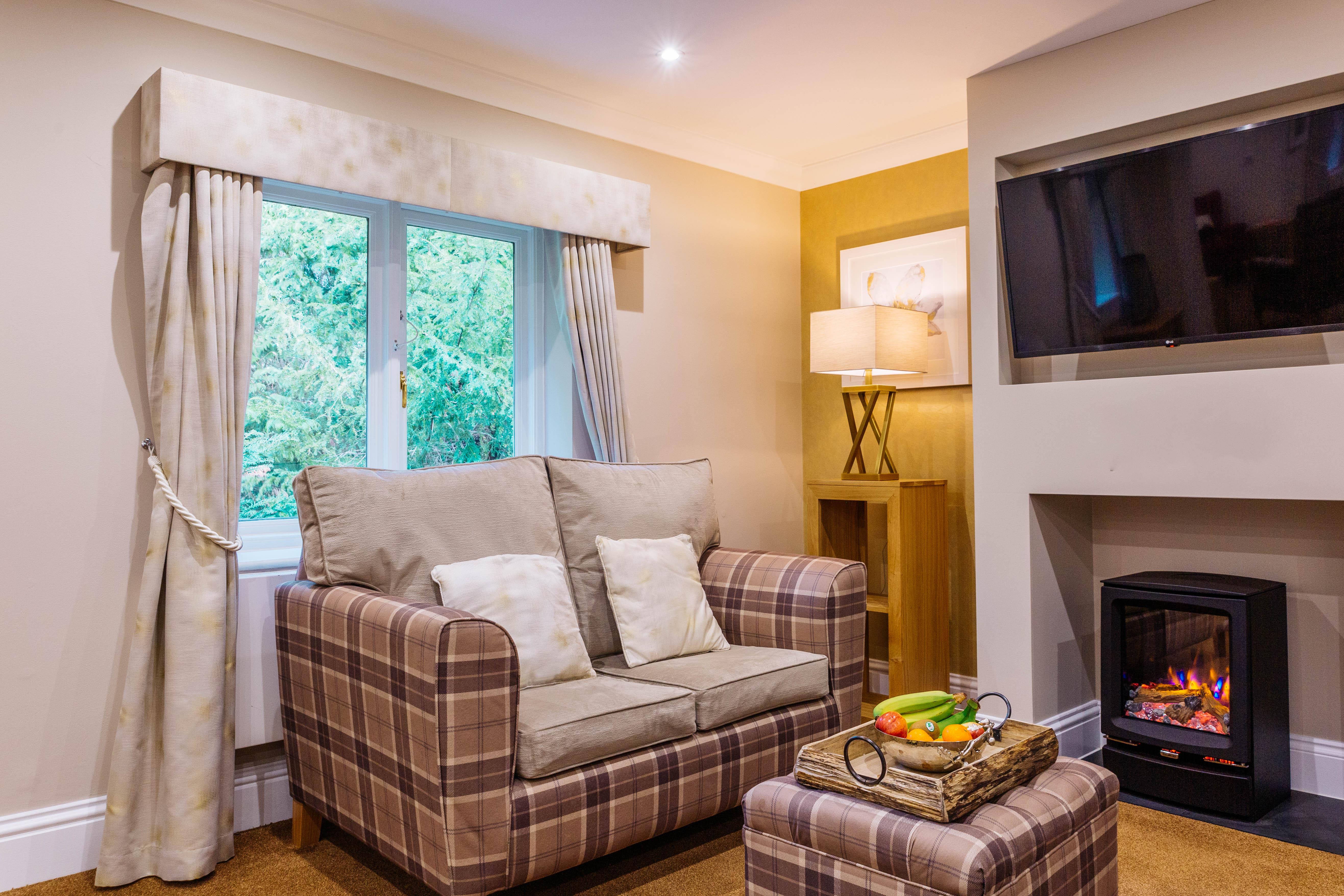 Lounge at Badgeworth Court care home in Cheltenham