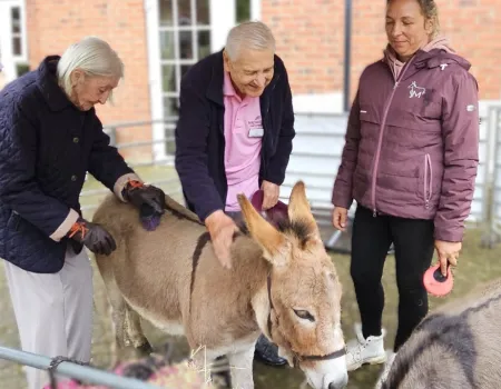 Residents Enjoy Donkey Visit to Home