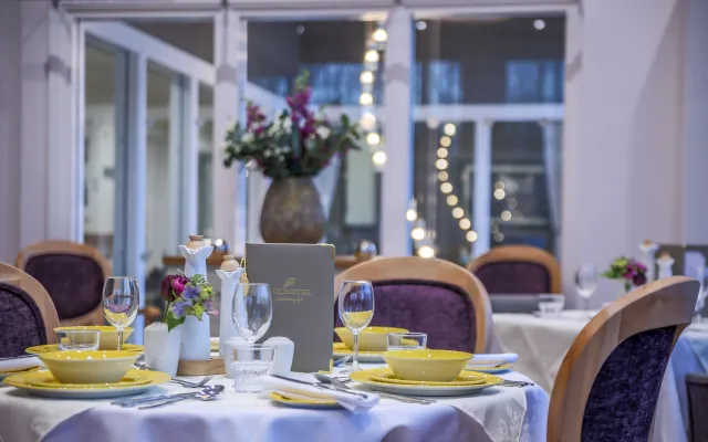 Table laid with adaptive yellow crockery