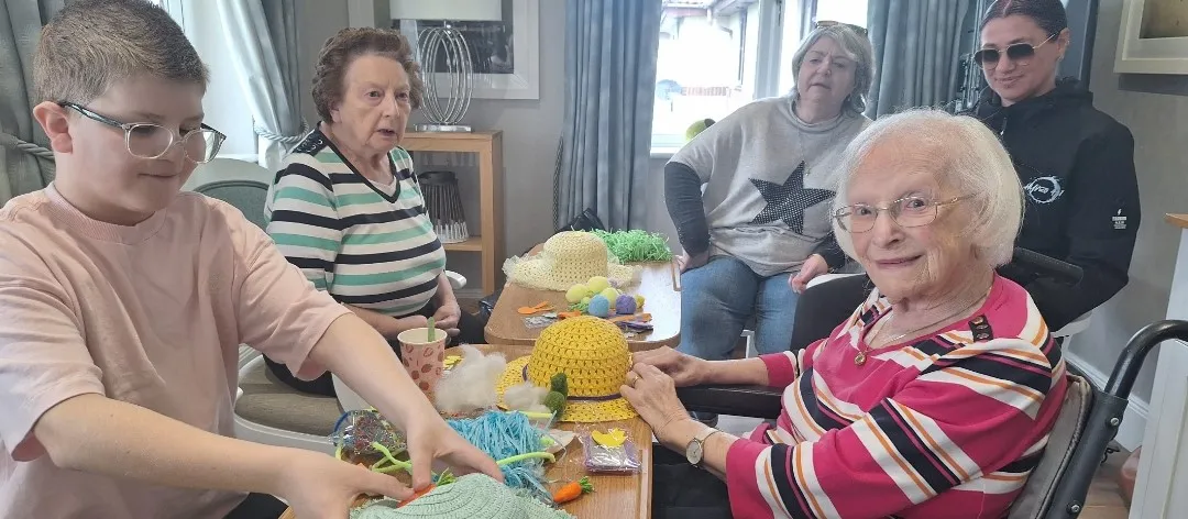 Intergenerational bonnet making
